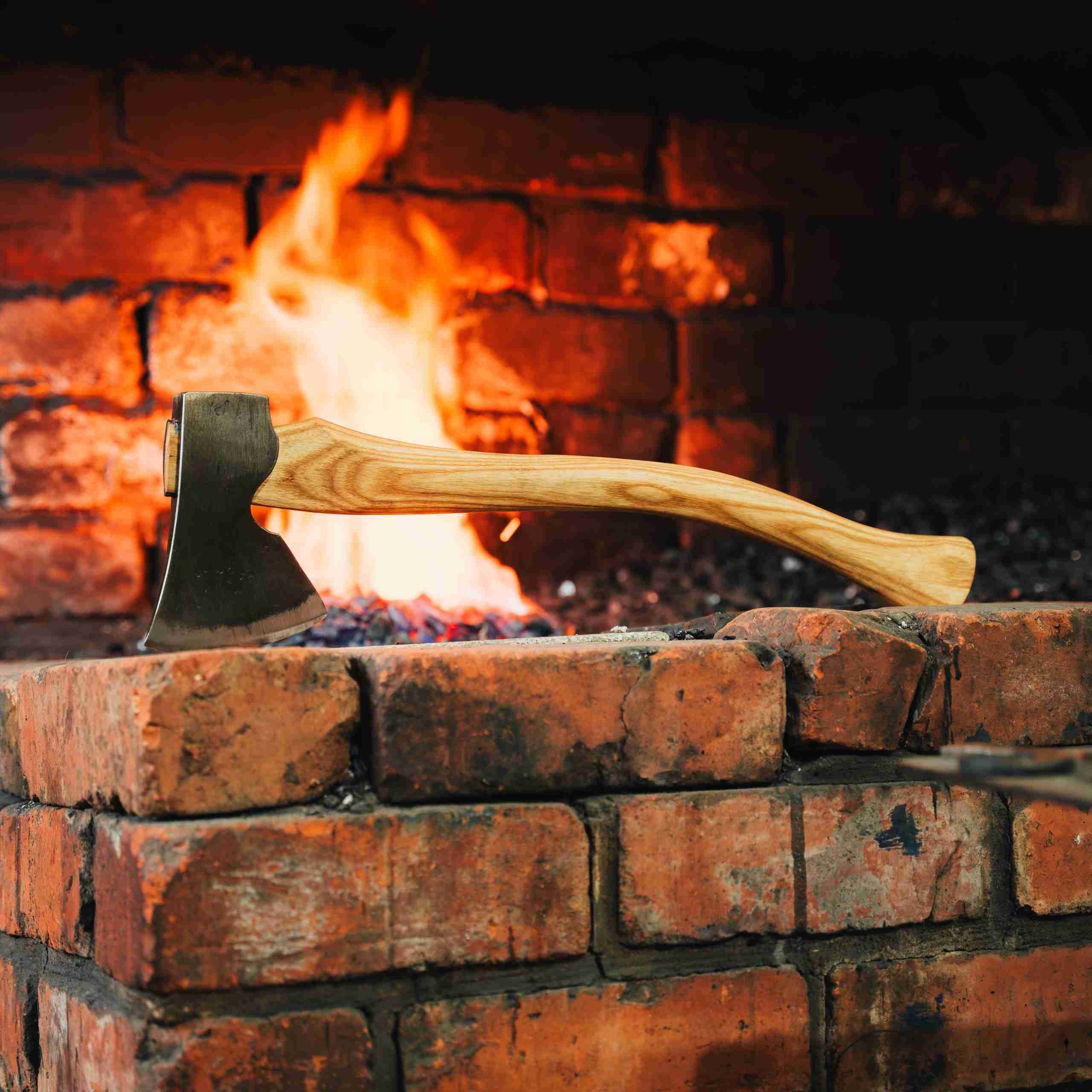 Axe in front of a fire