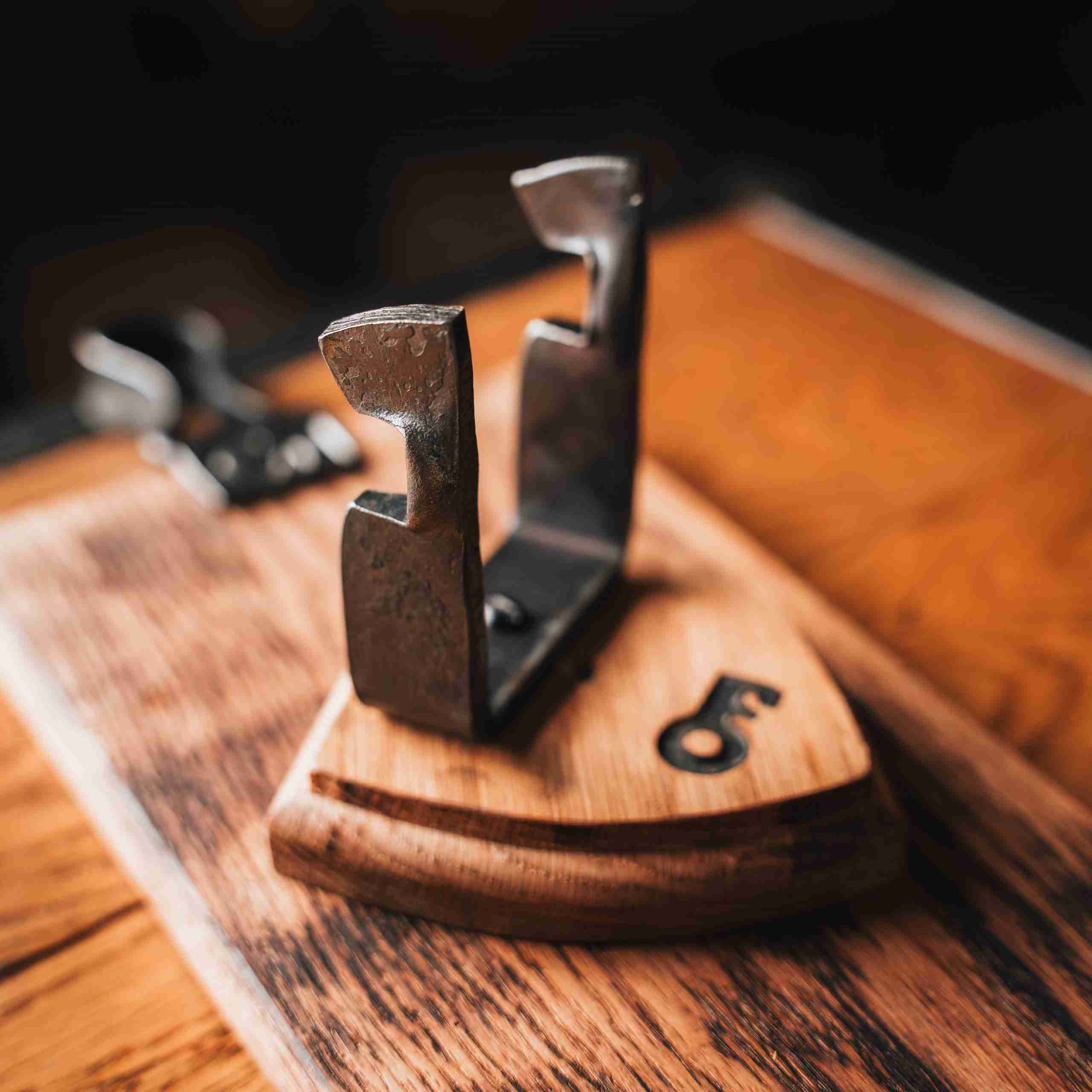 Wooden and metal sword display.