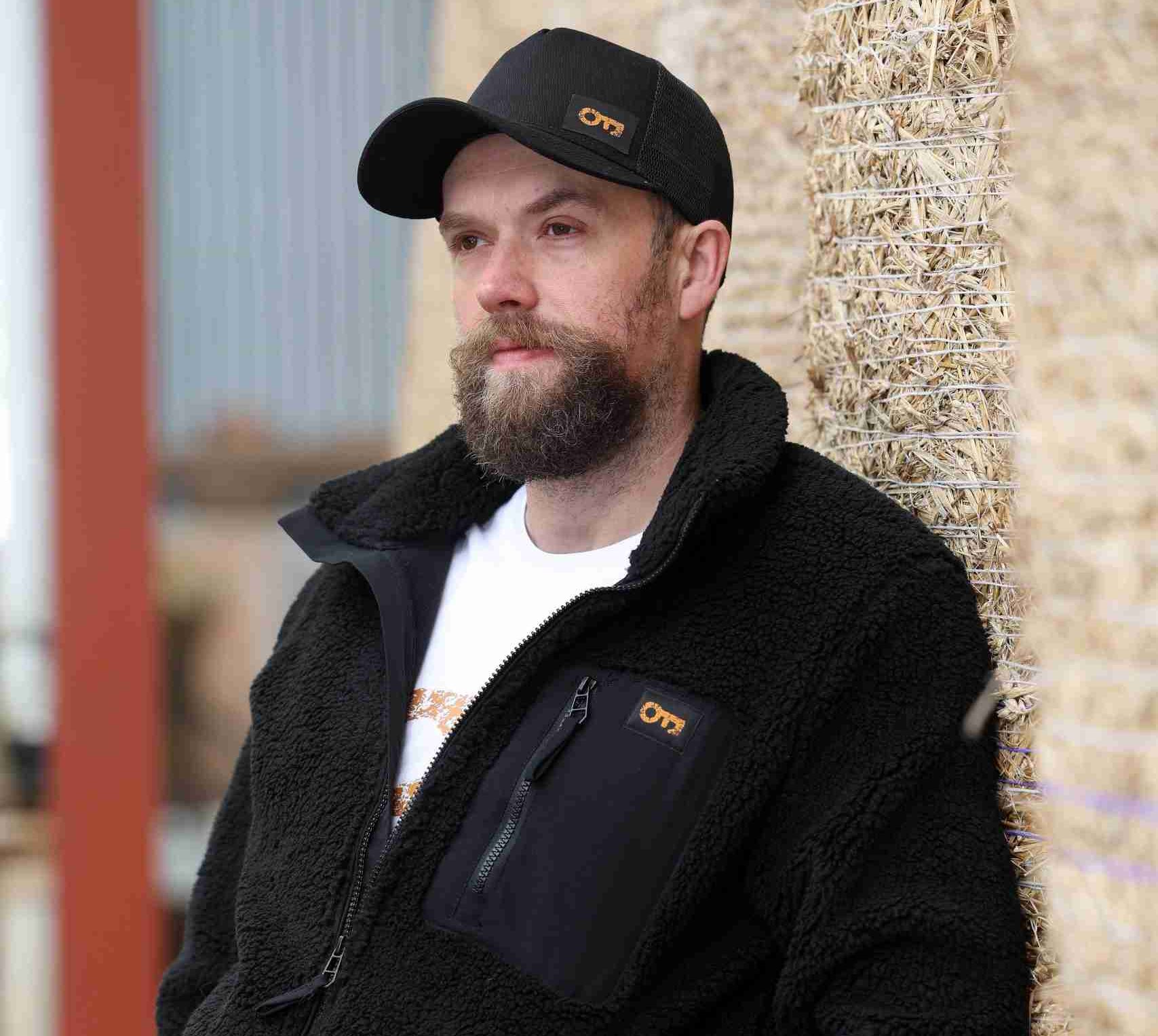Unisex fluffy fleece with key patch detail on breast pocket.
