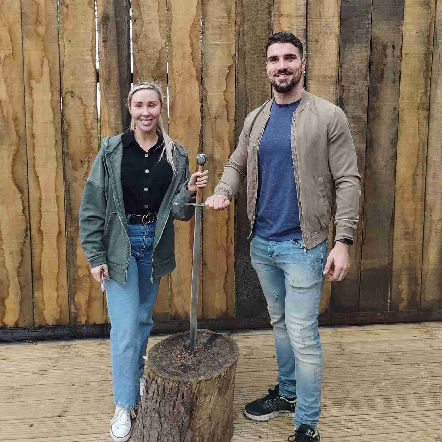 Couple holding sword