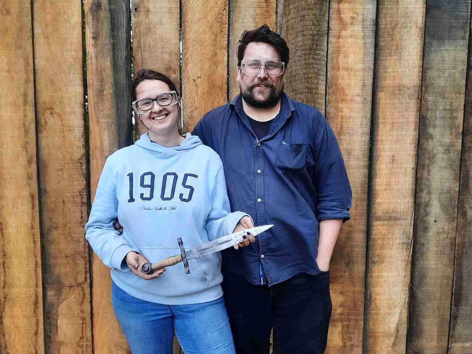 Couple holding a dagger
