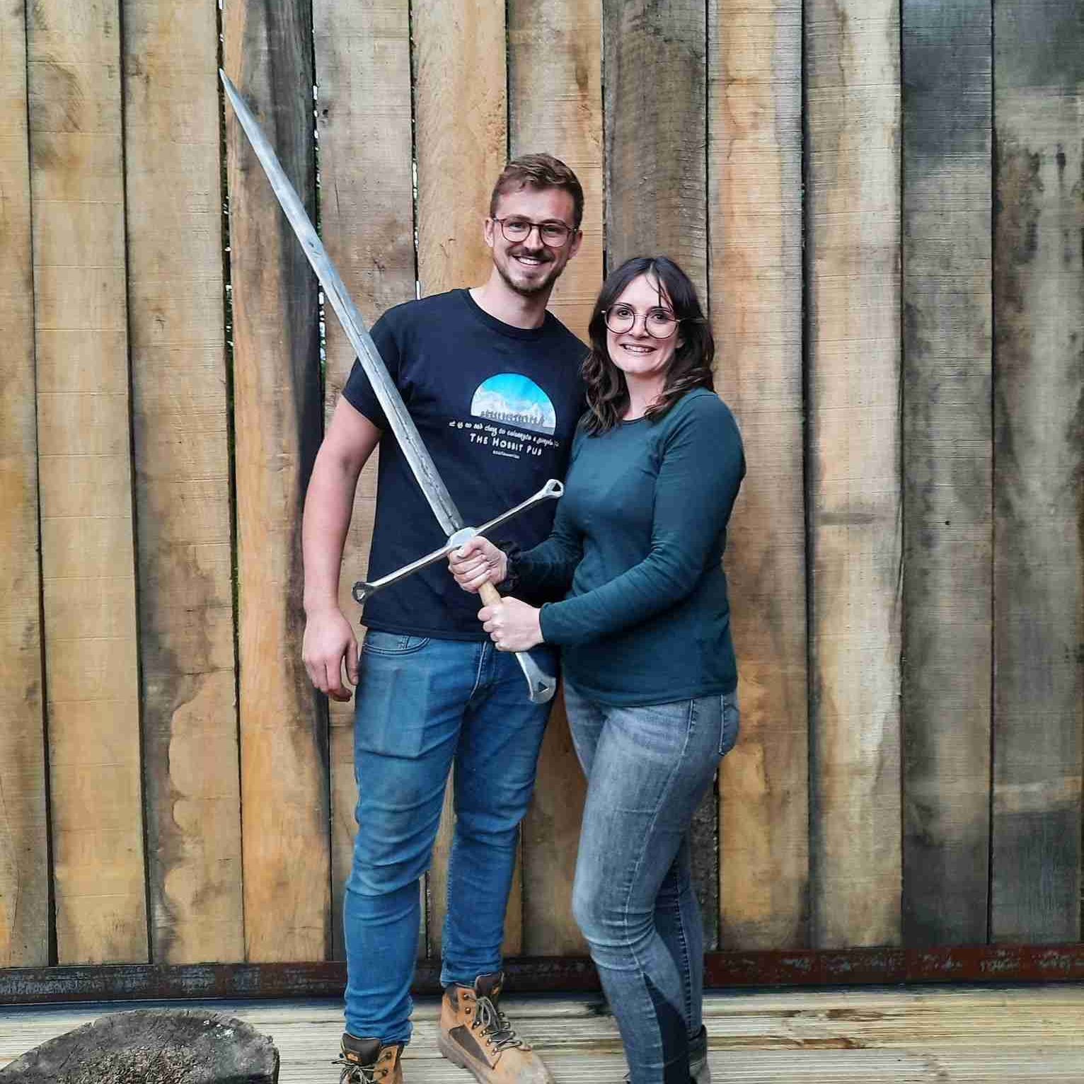 Couple holding sword
